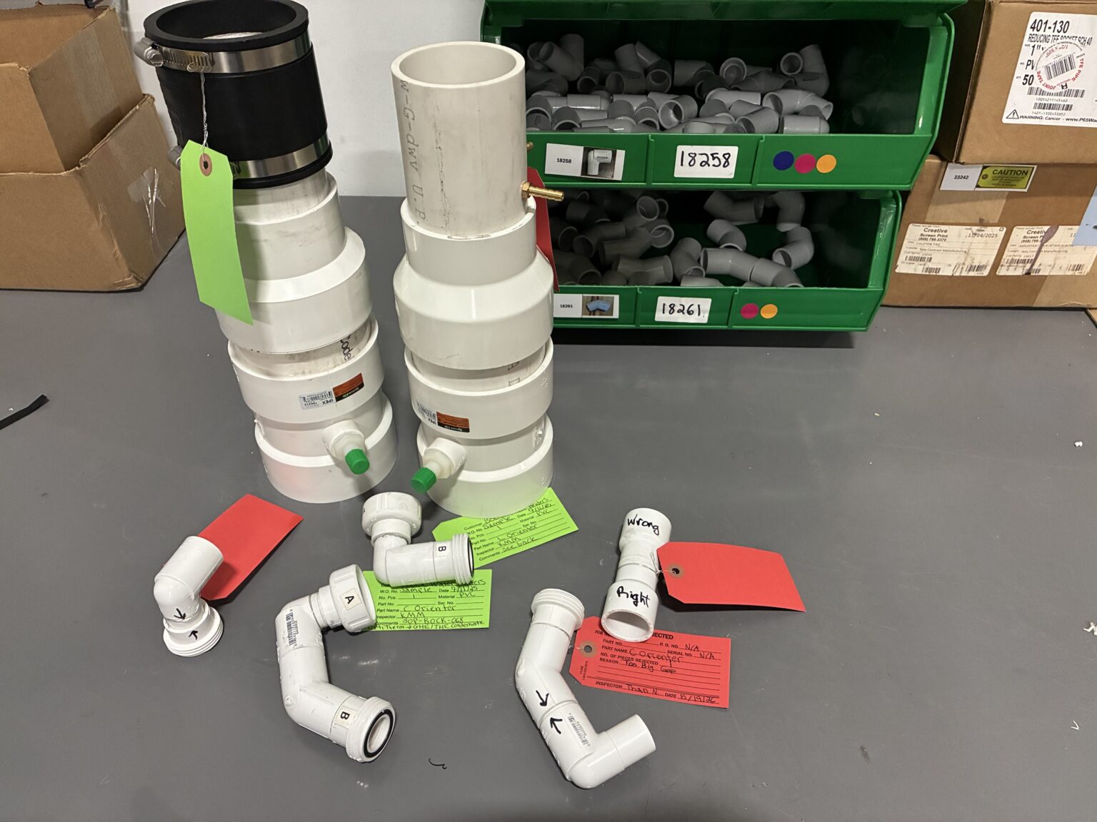 PVC intake, exhaust and condensate subassemblies staged for kitting