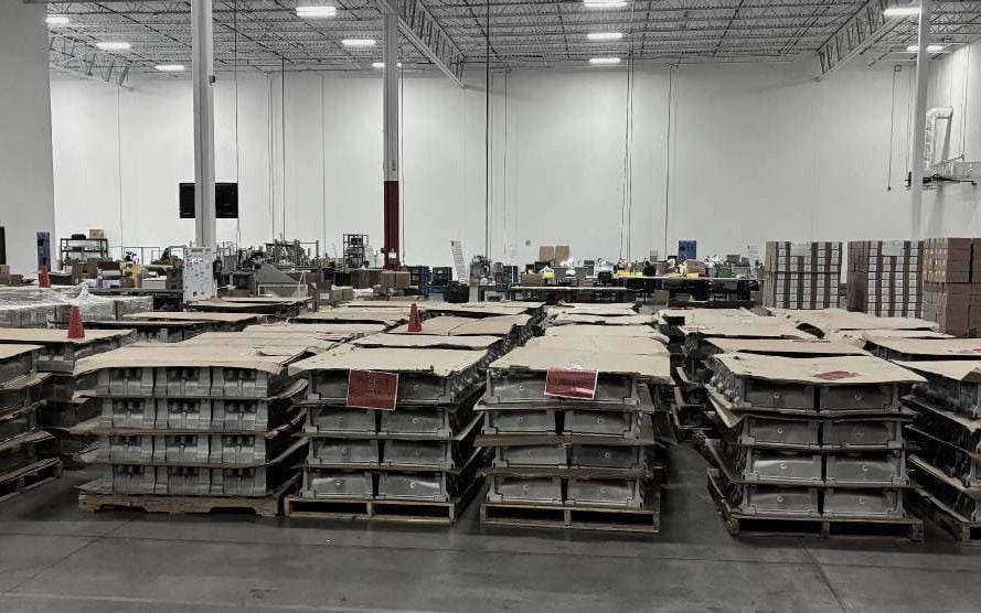 Pallets of inspected castings staged in rows on the RELY floor
