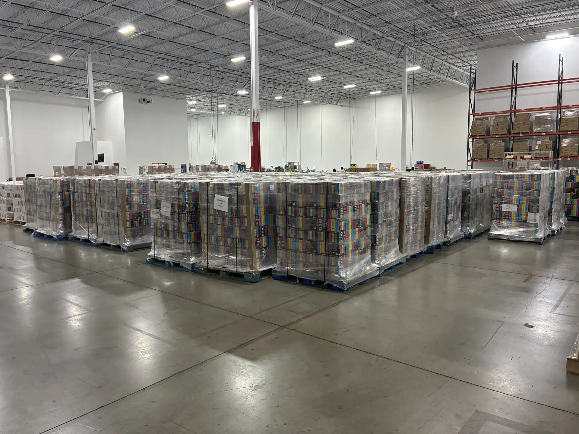 Shrink-wrapped pallets of staged inventory on the RELY floor in Menomonee Falls